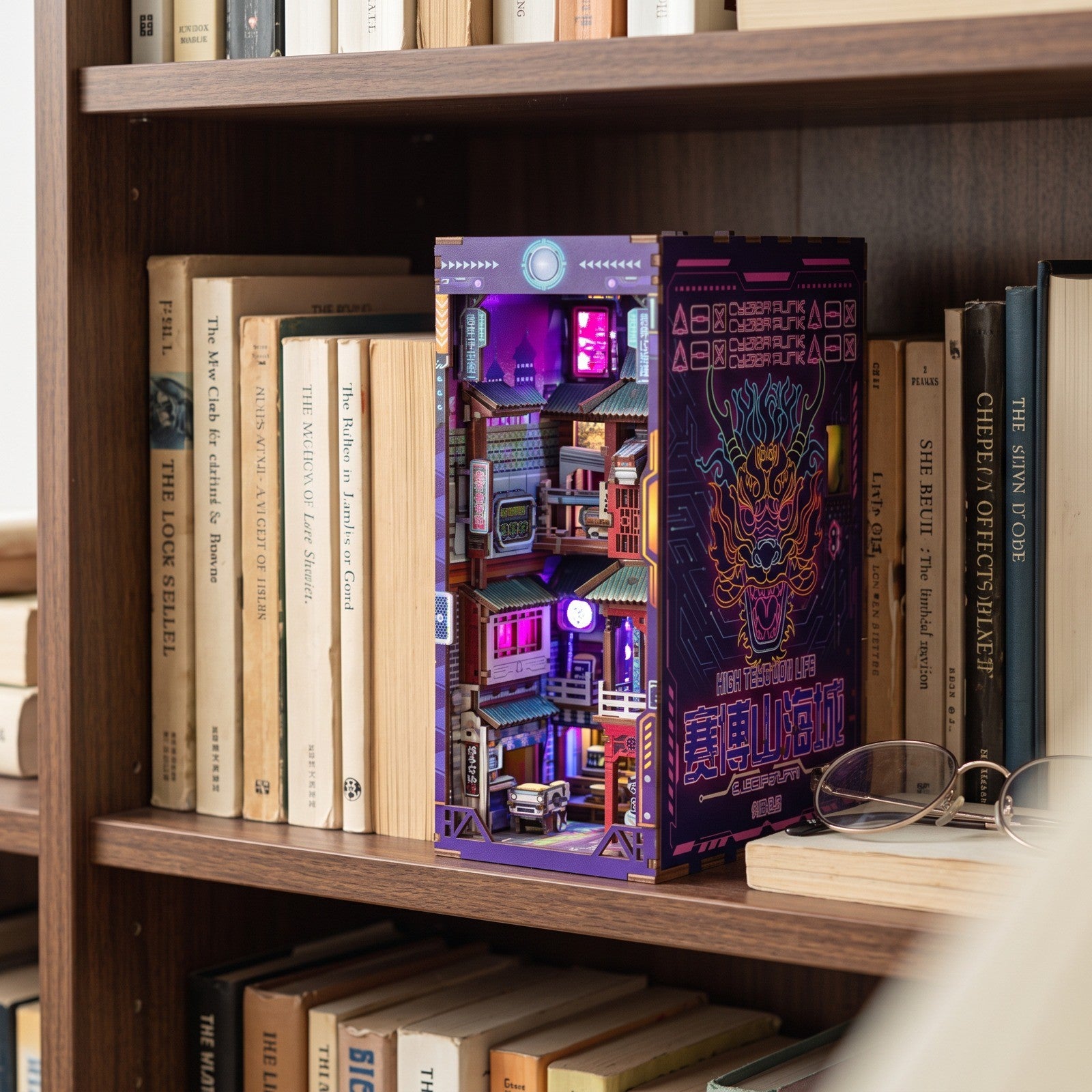 Finished miniature city on a daylight bookshelf