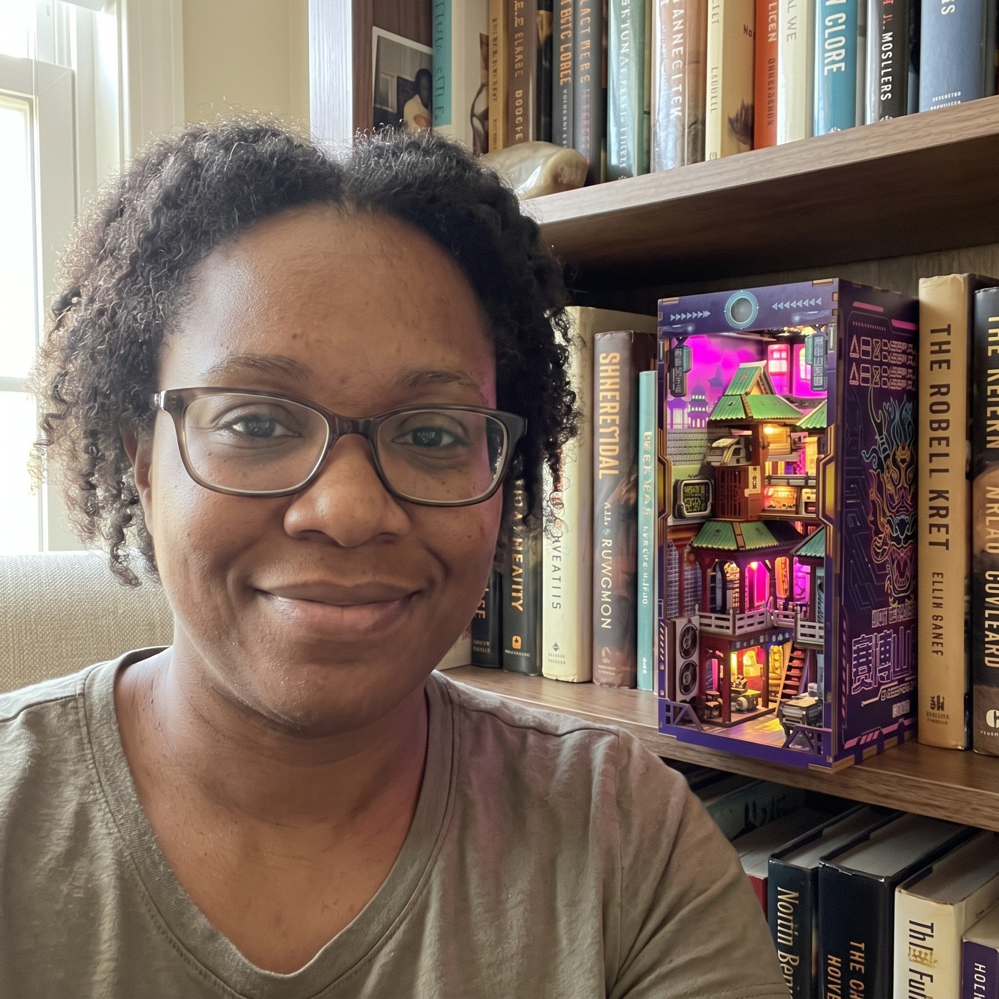 Woman taking a selfie beside her library shelf