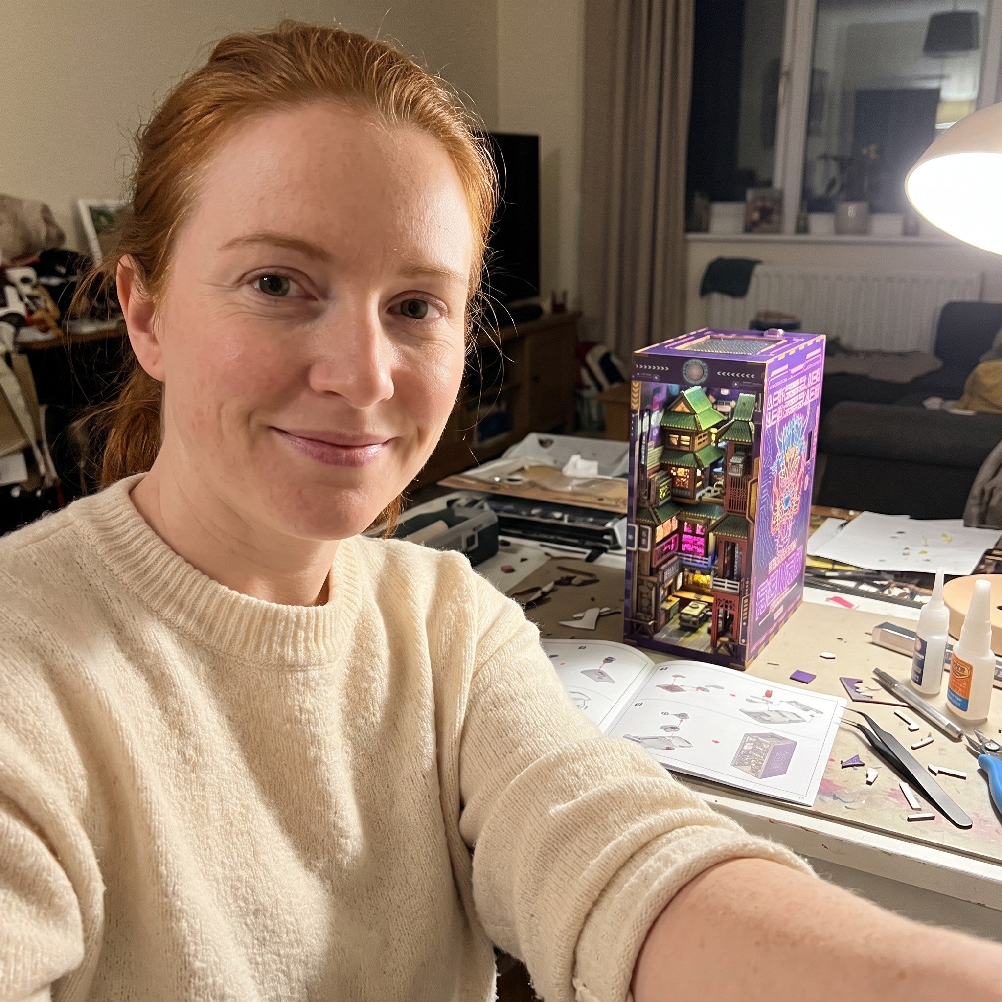 Woman taking a selfie at her craft table